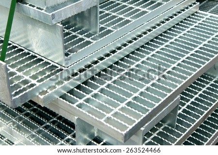 Hot-dip galvanized steel grating bunch on the rack in warehouse before shipment