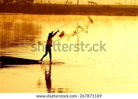 Silhouette fishermen fishing in the pond