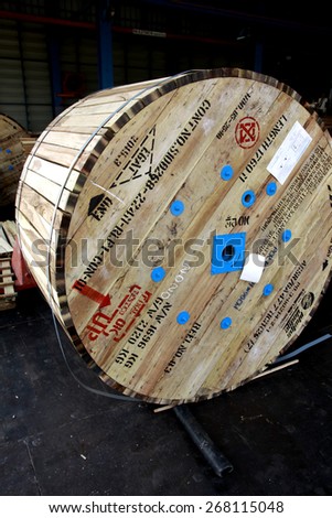 BANGKOK-THAILAND-MARCH 11 : Old wooden wheel of electrical cable in warehouse before shipment on March 11, 2015 Bangkok, Thailand