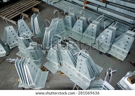 Hot-dip galvanized steel structure for Transmission line steel tower bunch on the rack in warehouse before shipment