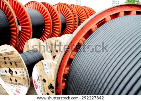 BANGKOK-THAILAND-JULY 22 : Old wooden reels & steel reels of power electrical cable in warehouse on July 22, 2014 Bangkok, Thailand