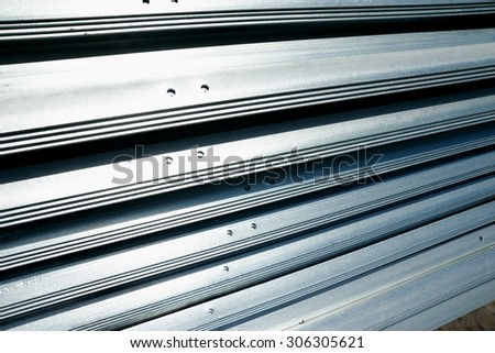 Hot-dip galvanized steel angles bunch on the rack in warehouse before shipment