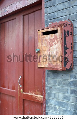 post office box and red door