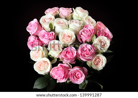 bouquet of artificial roses on a black background