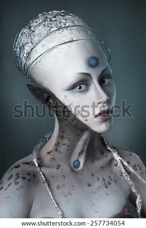 Portrait of a mysterious woman with a fantastic makeup Alien