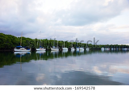 Port Douglas river landscape with sailing boats, photographed at twilight.