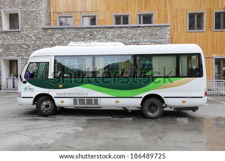 LIXIAN,CHINA - APRIL 5,2014: Tourist bus stop in the parking lot.