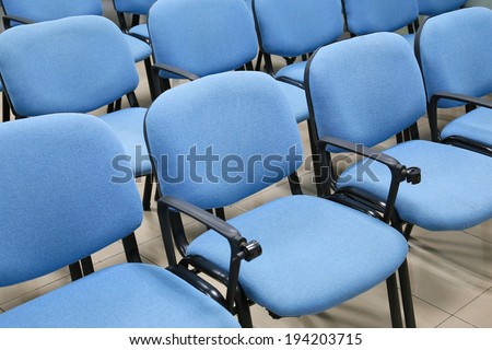 blue chairs in office meeting room
