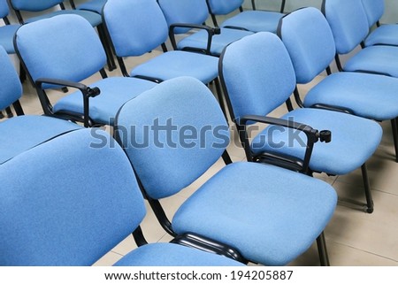 blue chairs in office meeting room