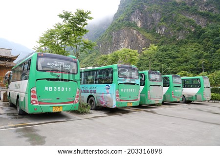 BEICHUAN,CHINA - 28 June,2014:green travel bus before the BEICHUAN earthquake  tourist center.