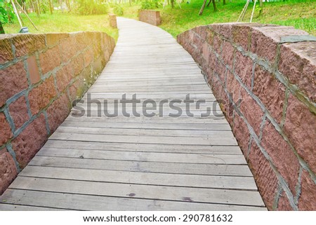 wood path in the park.