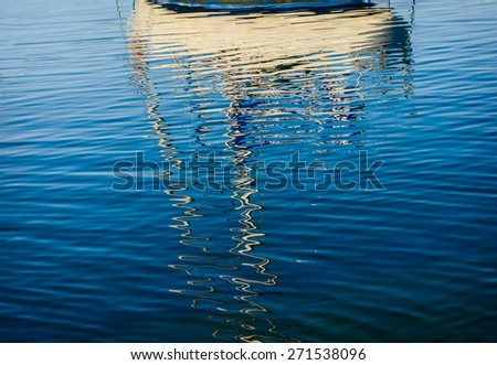 Abstract reflections of boats in the harbor water on Pacific ocean, Wellington, New Zealand