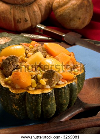 Carbonada: typical food of Argentina ( ingredients pumpkin,maize,meat,rice,carrots,peachs and potatoes) serving in a pumpkin