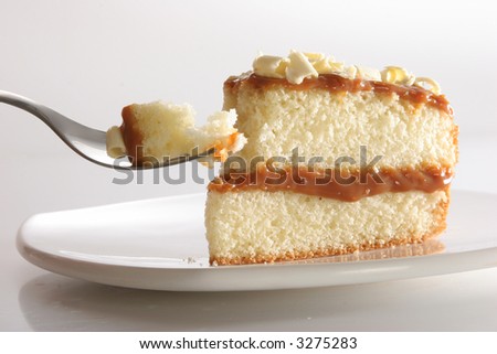 Slice of layered vanilla or lemon cake, stuffed with \