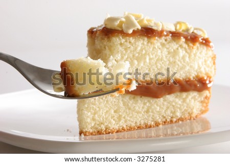 Slice of layered vanilla or lemon cake, stuffed with \
