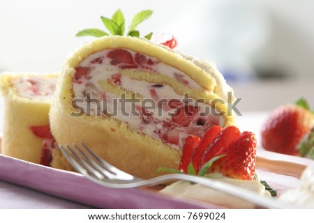 Recipe of cold dessert (strawberries, ice cream, cream) on sweet biscuit roll