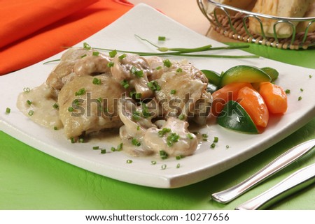 A recipe of chicken and champignon stew, served with boiled vegetables