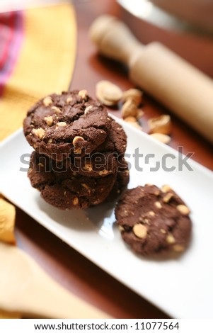 Homemade chocolate cookies on table, selective soft focus