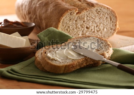 Still life shot with integral bread sliced, butter and knife