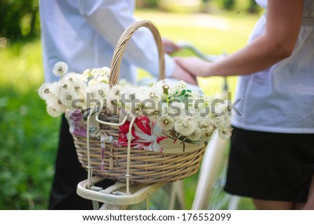 basket with dandelions on a bicycle romantic walk with bicycle basket with flowers on a bicycle