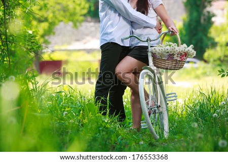basket with dandelions on a bicycle basket with flowers  on a bicycle Picnic time romantic walk with bicycle