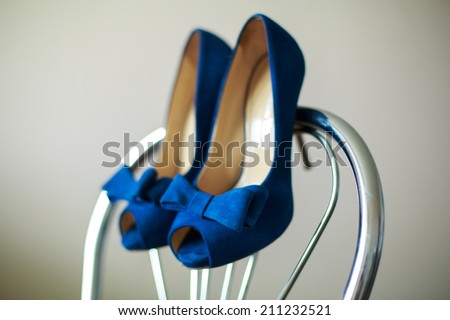 beautiful bride shoes\
  beautiful girl in shoes with high heels\
elegant pair of blue shoes with heels\
 shoes on a chair