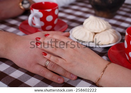 young couple held hands romantic dinner man and woman talking over coffee young couple on served table