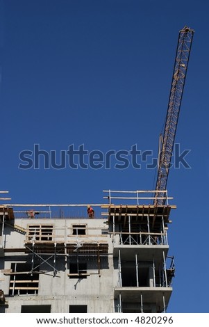 Workers on top and crane