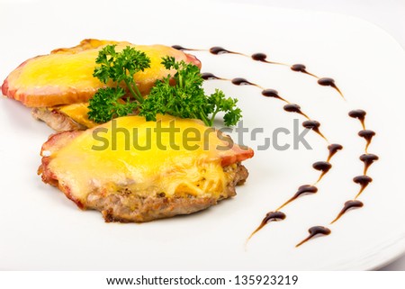 Meat patty with bacon and melted cheese and dill