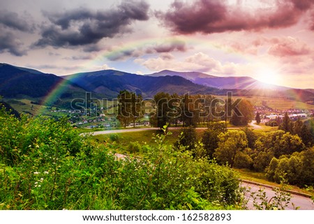valley near forest on a steep mountain slope after the rain in evening mood