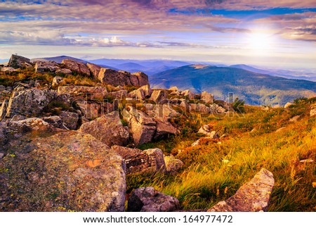 valley with stones on the mountain top in morning light