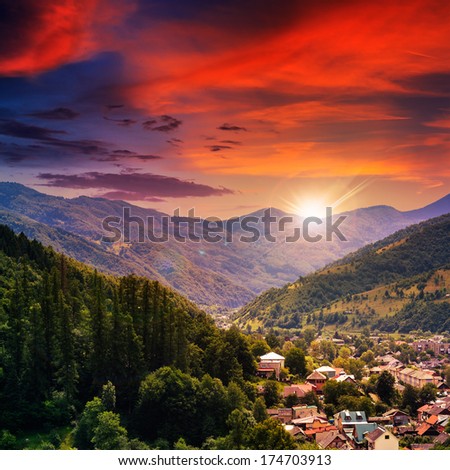 Autumn Landscape. Village On The Hillside. Forest On The Mountain Light Fall On Clearing On Mountains In Evening