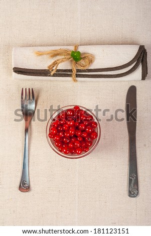 restaurant served red currants in a glass with green leaves