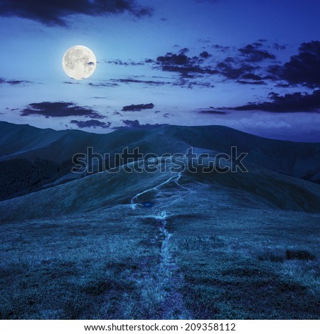 small lake near mountain curve path on a Green Hill at night in full moon light