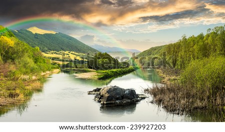 collage mountain river with stones and grass in the forest near the mountain slope with rainbow