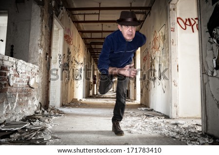 Man runs away in abandoned building