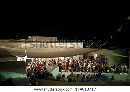 KASOS ISLAND, GREECE - AUGUST 15: People enjoy a dance festival during Virgin\'s Mary cerebration day in Kasos Island on August 15, 2013