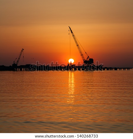 Navy Pier against the setting sun (Russia, Black Sea Coast, Anapa).