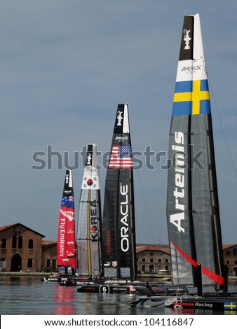 VENICE, ITALY - MAY 15: Four catamarans AC45 in the team bases area waiting for a new test in the Venice lagoon during the America\'s Cup previous races days in May 15, 2012 in Venice, Italy.