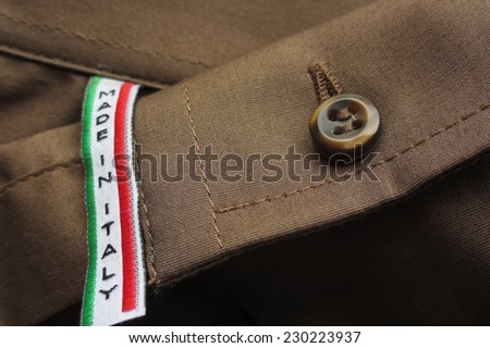 Made in Italy label on brown cotton shirt