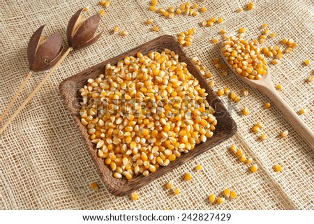 corn as natural ingredient in a wooden cup - country style