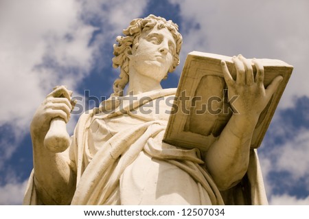 Classical antic greek statue of woman with the book