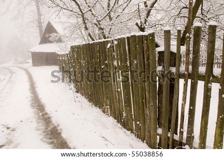The wooden fence along the countryside road in cold winter, Slovakia