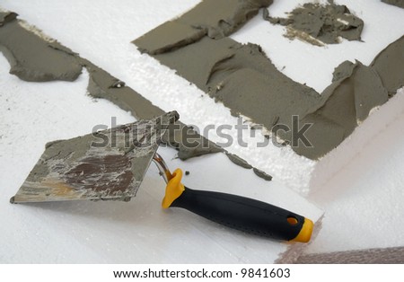 a plastering tool for adhesive