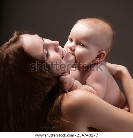Baby biting his mom