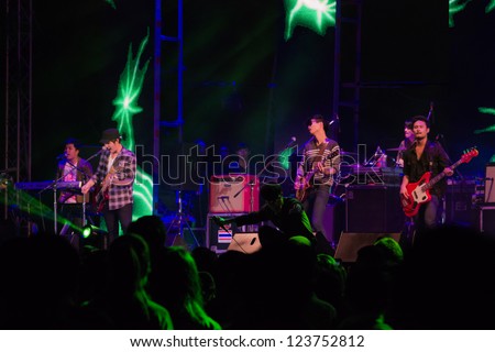 HUA HIN, THAILAND - DECEMBER 31 : Lead singer of Musketeers rock band performs live concert during Hua Hin Music Countdown 2013 on  December 31, 2012 in Hua Hin, Prachuapkhirikhan, Thailand