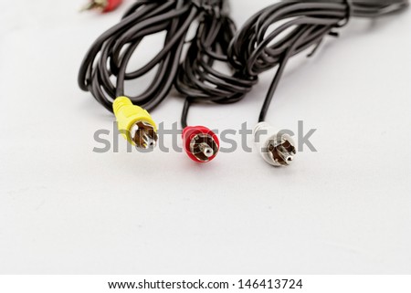 three audio (left - right) - video RCA cable and plug (red, white, yellow) on white background