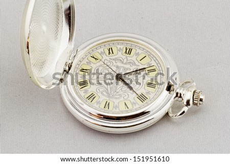 Part of a antique mechanical pocket watch on white background