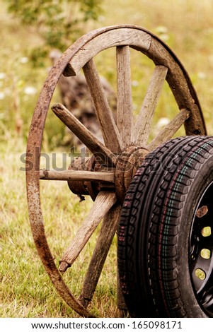 new and old broken wagon (car) wheel