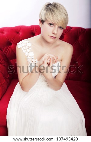 Absolutely awesome young short haired blonde girl with bridal dress